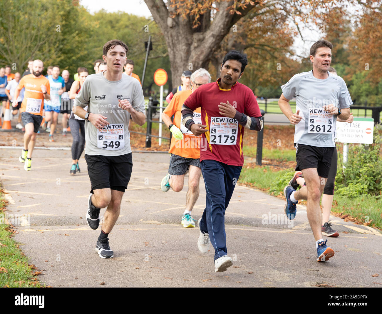Runners in the Cambridge Town and Gown 10k run 20th Oct 2019 scenic run passing landmarks, historic University Colleges and along river cam Stock Photo