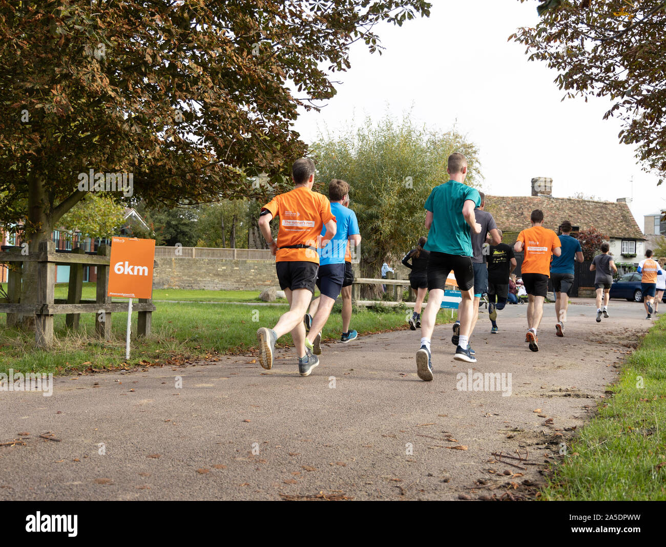 Runners at 6K point Cambridge Town and Gown 10k run October  2019 scenic run passing landmarks, historic University Colleges and along river cam Stock Photo