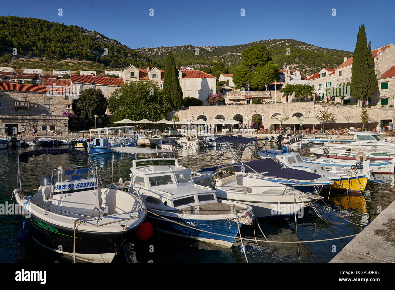 Bol marina with boats tied up in harbour, Brac, Croatia Stock Photo