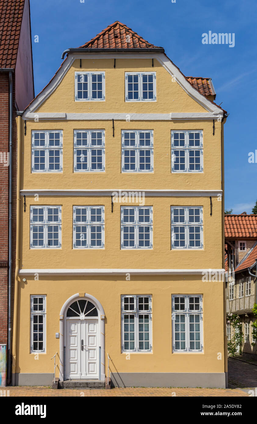 Historic yellow house at the waterfront of Flensburg, Germany Stock