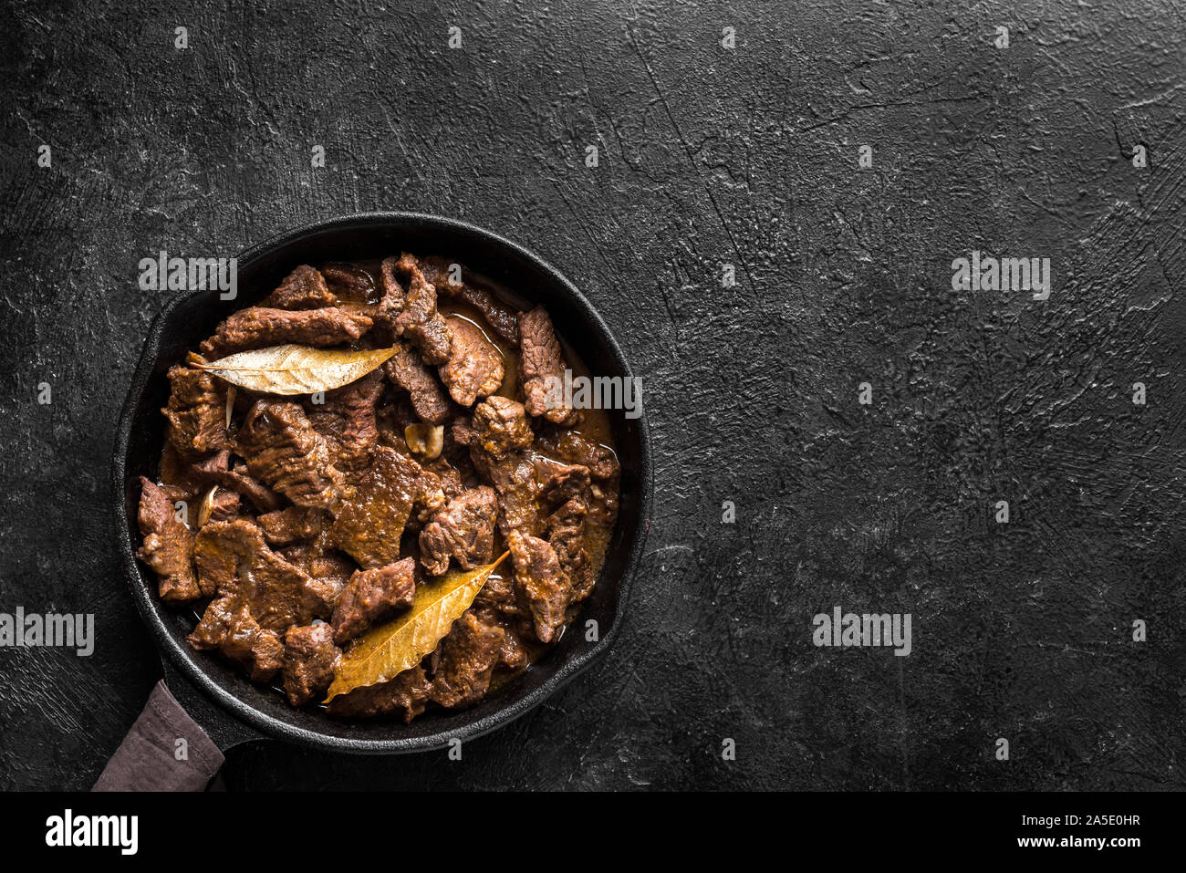 Meat Stew. Beef stewed in red wine sauce, top view, copy space. Roasted