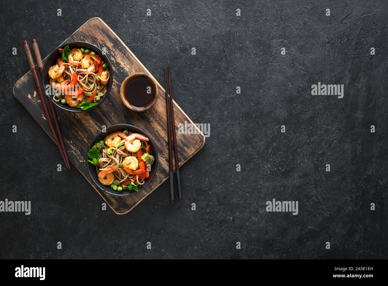 Stir fry with soba noodles, shrimps (prawns) and vegetables. Asian
