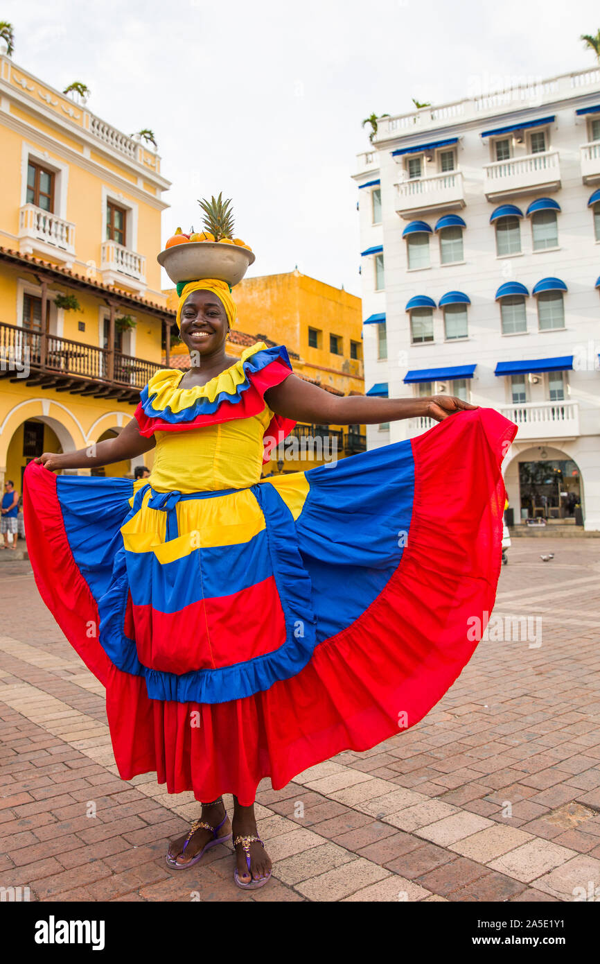 CARTAGENA, COLOMBIA - SEPTEMBER 16, 2019: Unidentified palenquera, fruit seller lady on the street of Cartagena, Colombia. These Afro-Colombian women Stock Photo