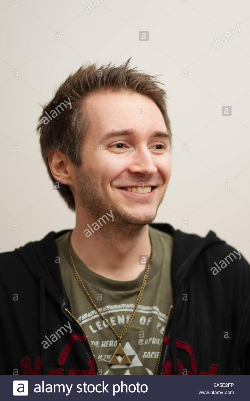 Young White Man With Spiky Hair Standing Over White Background