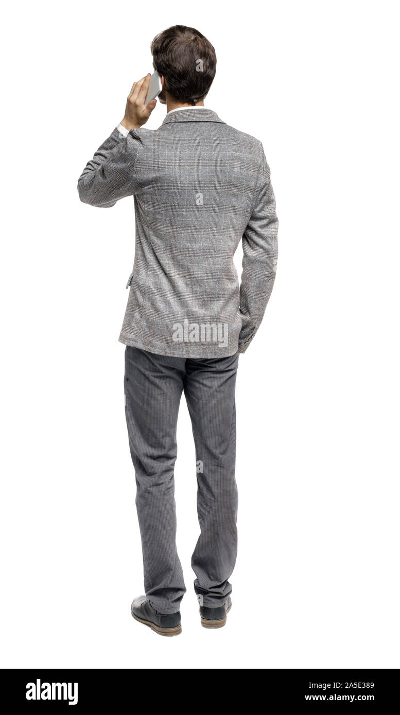 back view of business man in suit talking on mobile phone. rear view ...