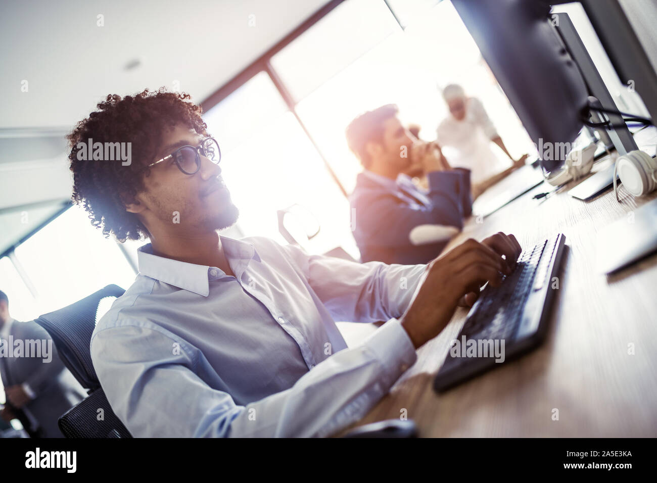 Programmer working in a software developing company office Stock Photo