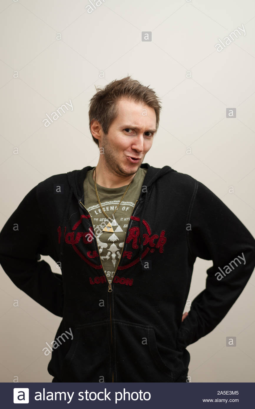 Young White Man With Spiky Hair Standing Over White Background