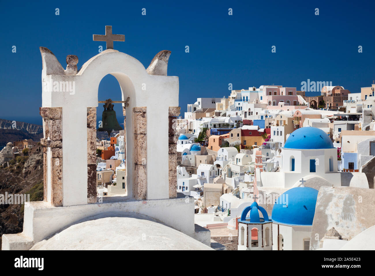 Oia with some chapels, view from the center to the west in Santorini. Stock Photo