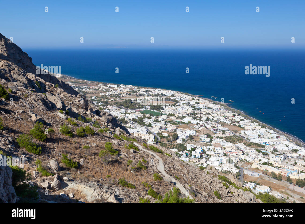View from halfway up to the Profitis Ilias down to Kamari, Santorini. Stock Photo