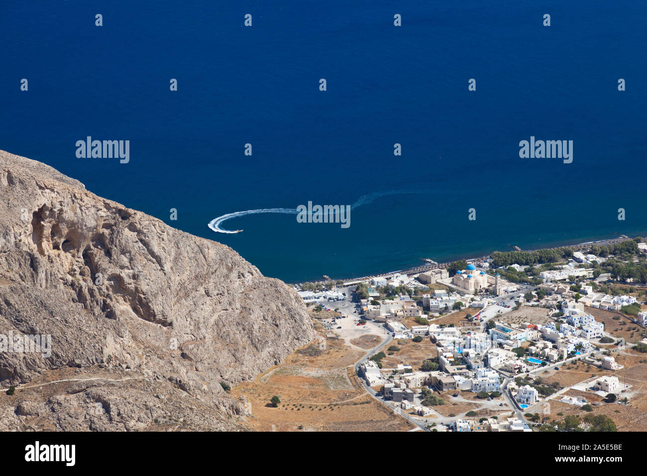 View from halfway up to the Profitis Ilias down to Perissa, Santorini. Stock Photo