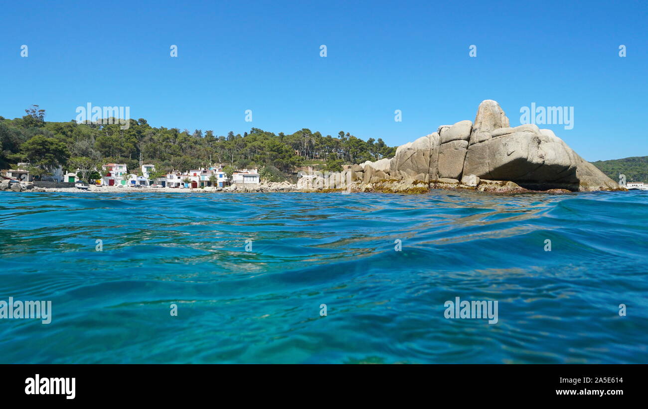 Rocky coastline with fishermen houses, Mediterranean sea, Spain, Catalonia, Costa Brava, Cala s'Alguer, Palamos Stock Photo