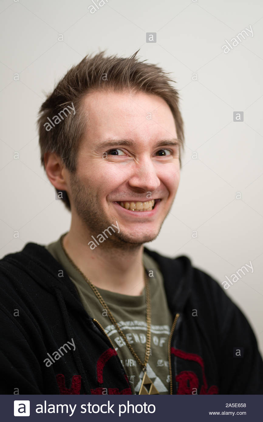 Young White Man With Spiky Hair Standing Over White Background