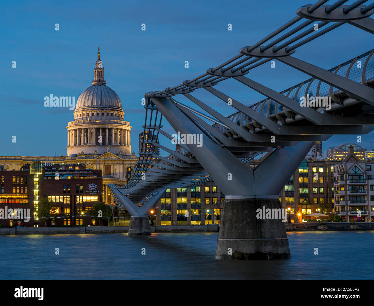 St Paul's Cathedral and Millennium Bridge  over River Thames at dusk, London, UK. Stock Photo