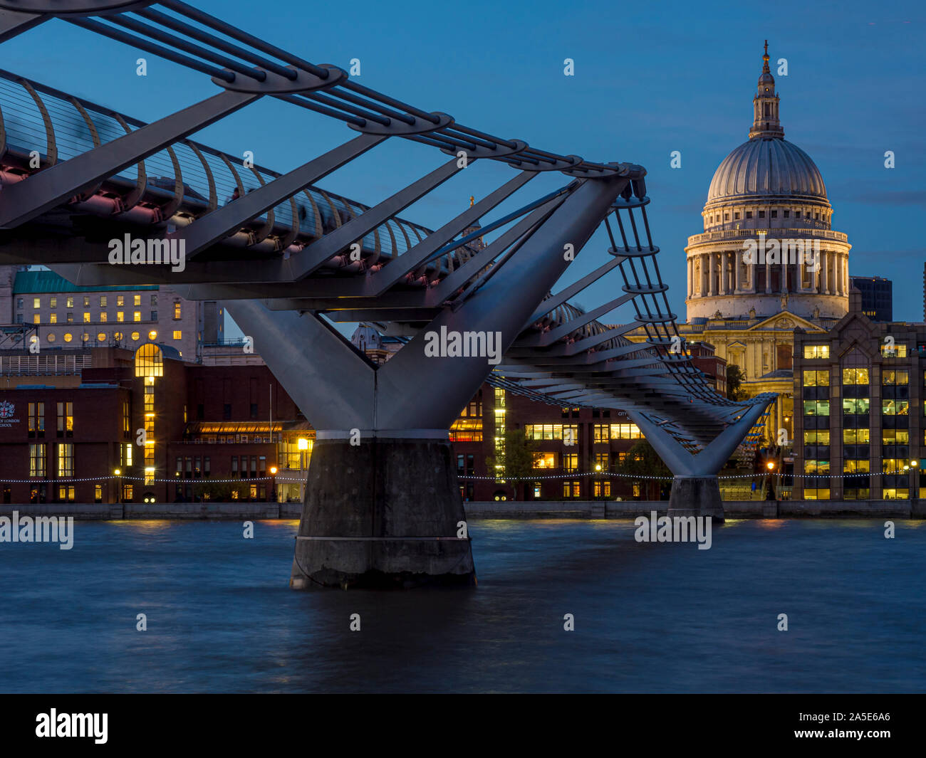 St Paul's Cathedral and Millennium Bridge over River Thames at dusk, London, UK. Stock Photo