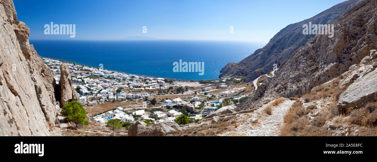 View from halfway up to the Profitis Ilias down to Kamari, Santorini. The island in the background is Anafi. Stock Photo
