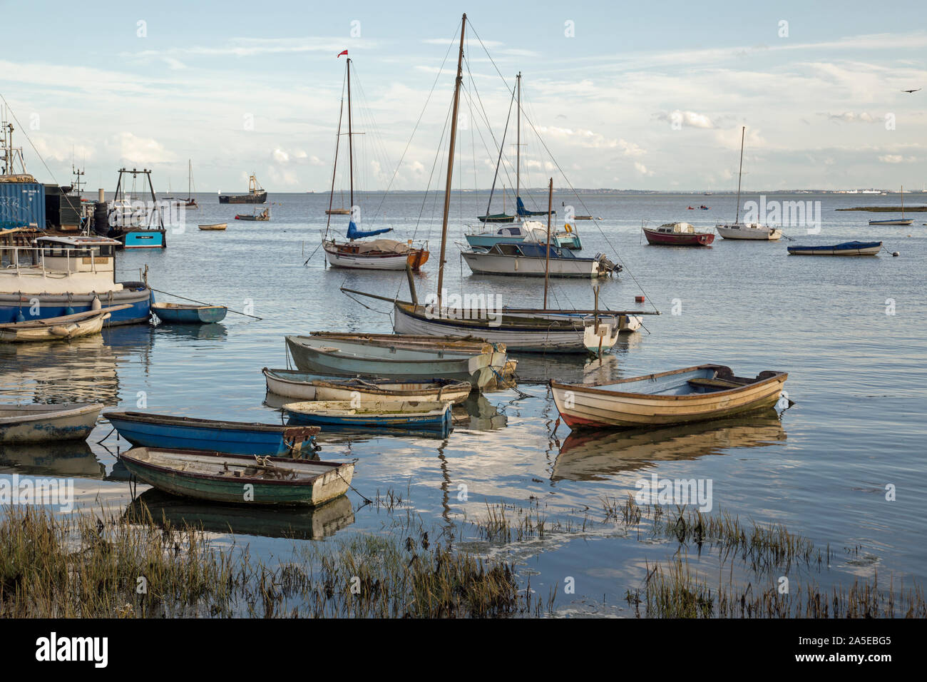 Leigh On Sea, Essex, England, October 2019, small rowing boats moored in shallow water. Stock Photo