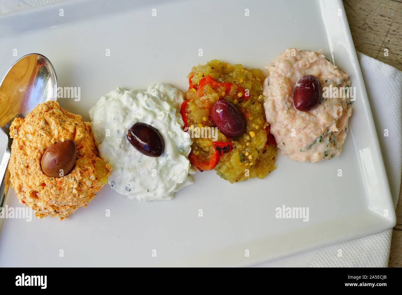 Platter Of Greek Spreads Including Tzatziki Taramosalata Spicy Feta And Eggplant Dip Stock Photo Alamy