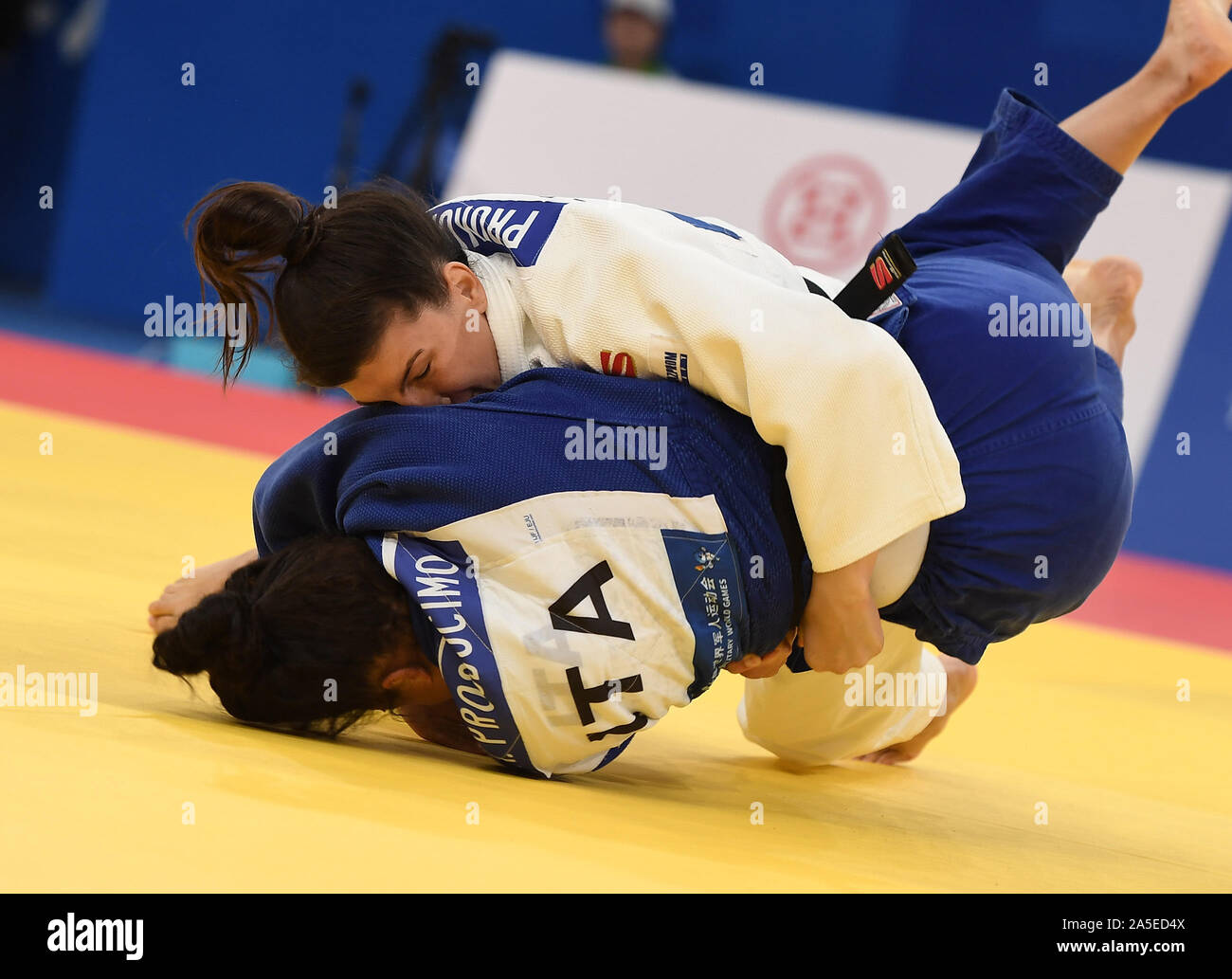 Wuhan, China's Hubei Province. 20th Oct, 2019. Alena Prokopenko (up) of Russia competes with Alessandra Prosdocimo of Italy during the women's 70kg judo final at the 7th International Military Sports Council (CISM) Military World Games in Wuhan, capital of central China's Hubei Province, Oct. 20, 2019. Credit: Li He/Xinhua/Alamy Live News Stock Photo