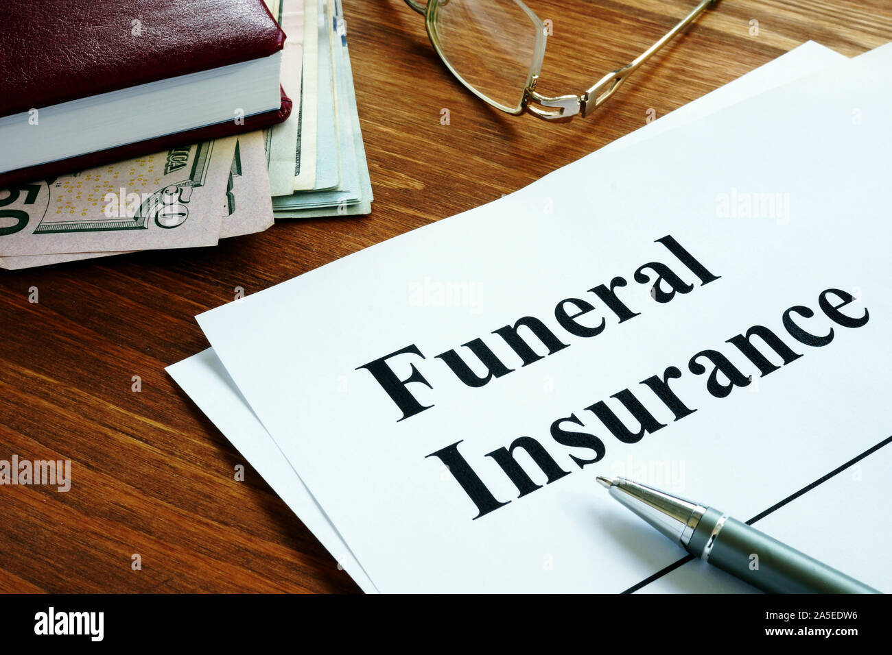 Funeral insurance agreement, money and glasses Stock Photo Alamy