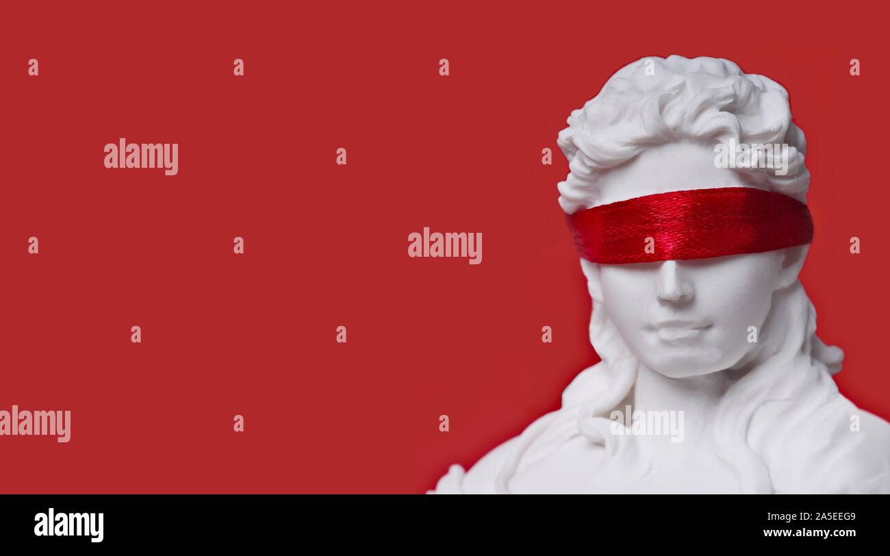 Close-up of lady justice with red blindfold. Panoramic image with copy space. Stock Photo