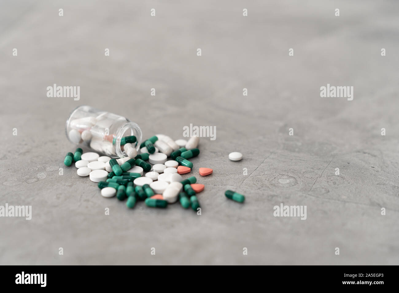 Bottle and pills on the floor. Medicine and Heath concept Stock Photo