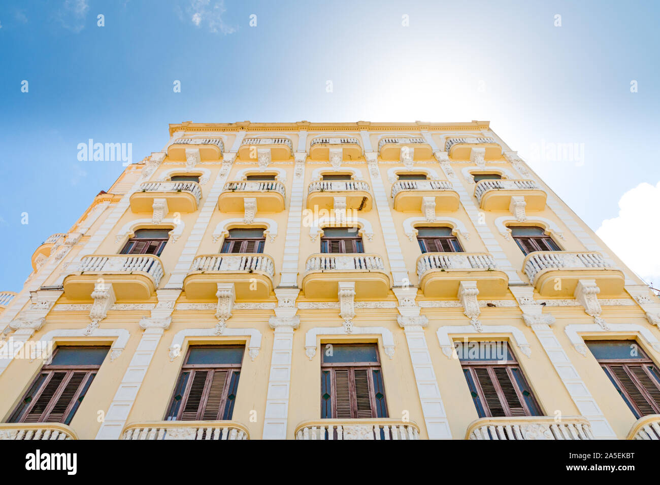 Facade of a yellow colonial building in Havana, Cuba. Stock Photo