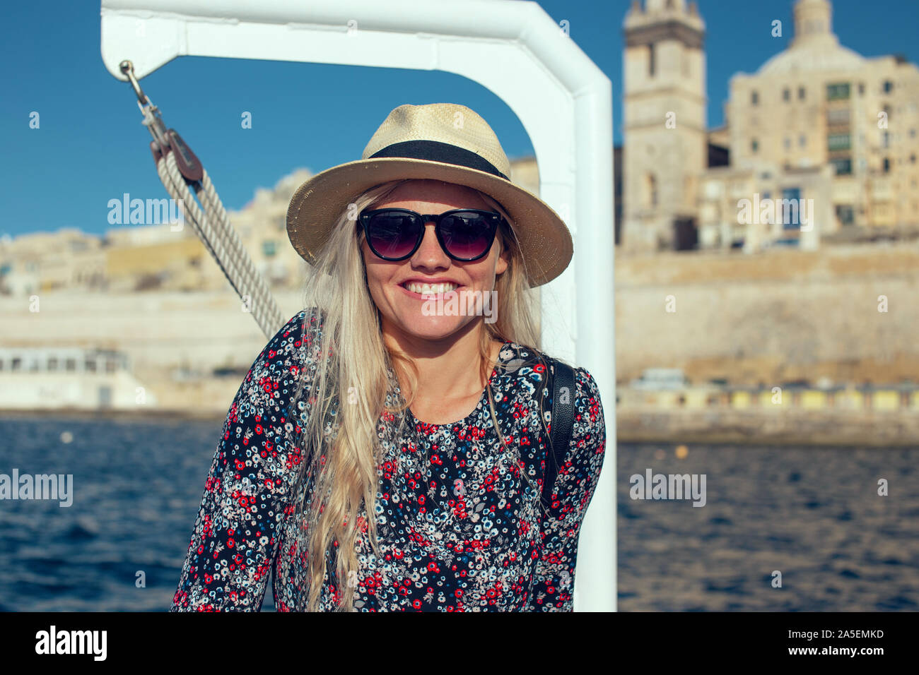 Happy young 20s traveler woman traveling by ship on Mediterranean sea Stock Photo