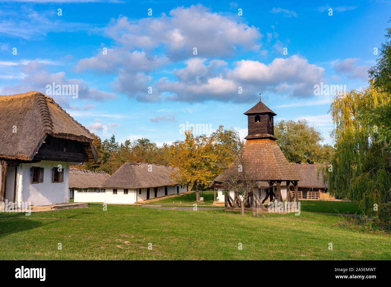 Historical old hungarian village with straw roof houses a bell tower Stock Photo