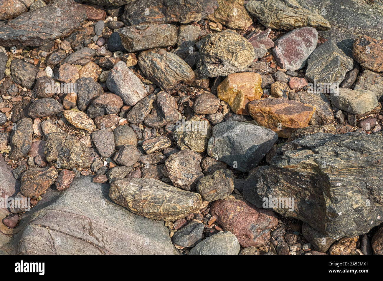 Background of stones in the beach, orange color Stock Photo
