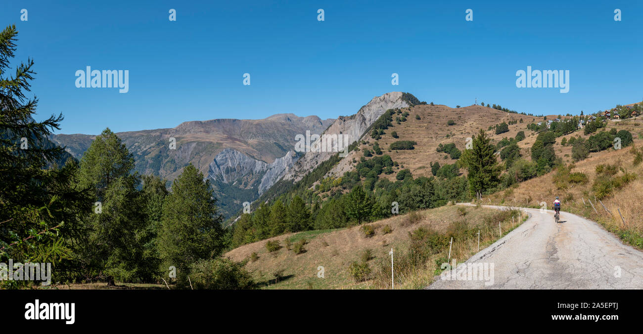 Female cyclist descending the climb from Villard Notre Dame, Oisans