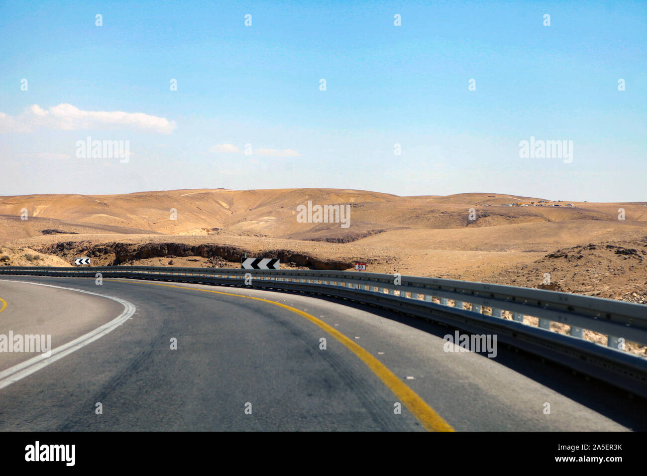 highway that runs along the Dead Sea from one side and Edom Mountains at Arava Desert from the other in Israel. Stock Photo