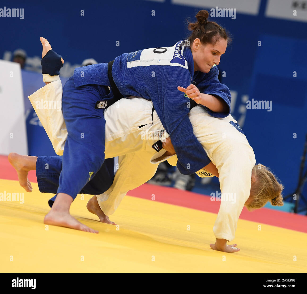 Wuhan, China's Hubei Province. 20th Oct, 2019. Klara Apotekar (top) of  Slovenia competes with Evelin Salanki of Hungary during the women's 78kg  judo final at the 7th International Military Sports Council (CISM)
