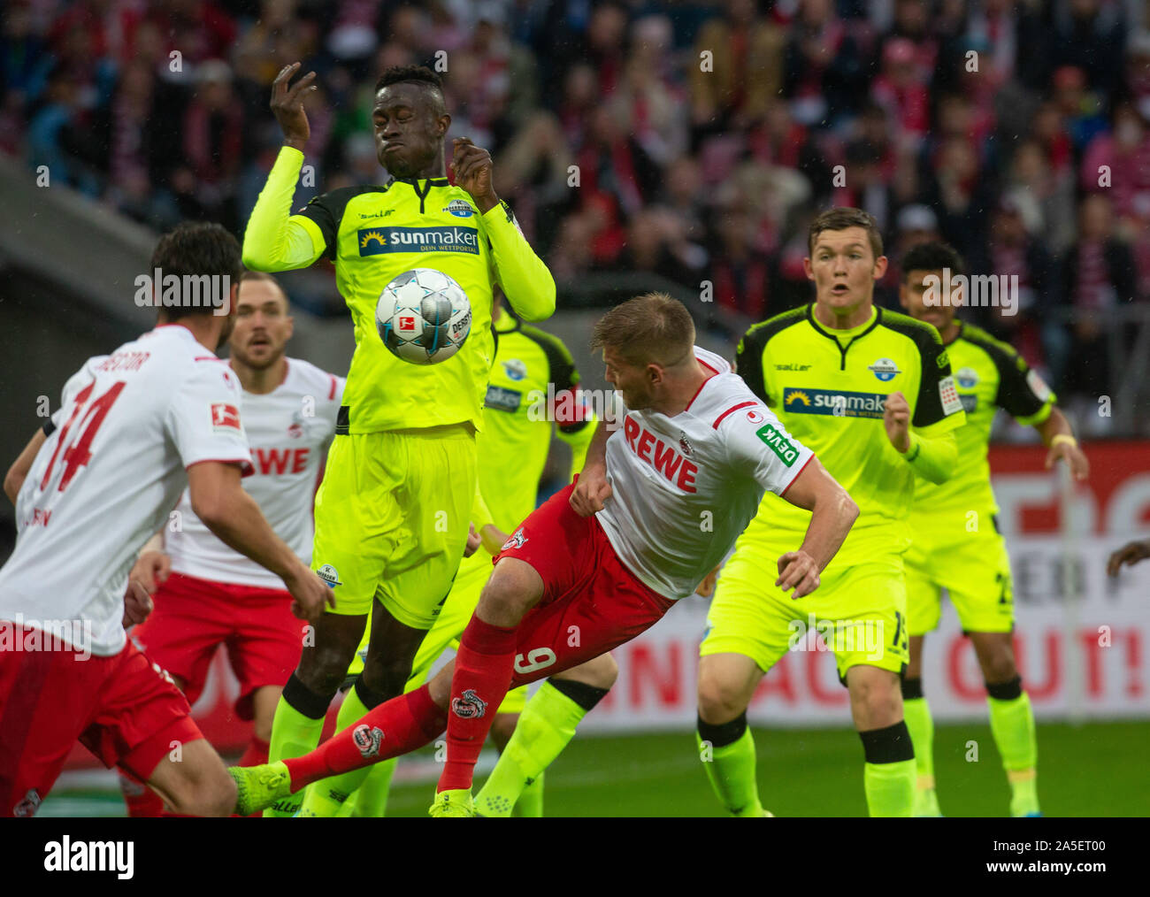 Cologne, Germany, 20.10.2019, Bundesliga matchday 8, 1. FC Koeln - SC  Paderborn: Babacar Gueye (Paderborn, C) against Simon Terodde (Koeln). DFL  REGULATIONS PROHIBIT ANY USE OF PHOTOGRAPHS AS IMAGE SEQUENCES AND/OR  QUASI-VIDEO