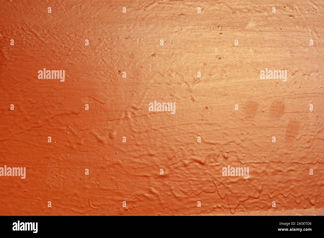 Old metal building sheet covered with brown paint with a golden tint in