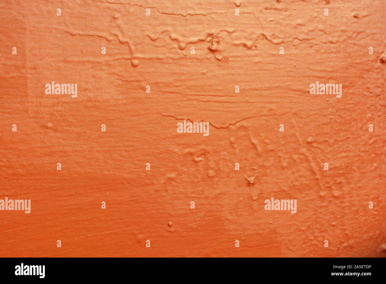 Old metal building sheet covered with brown paint with a golden tint in