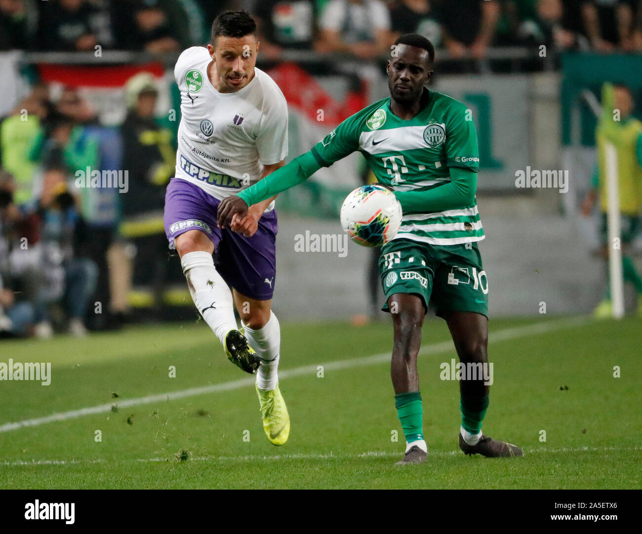 BUDAPEST, HUNGARY - AUGUST 29: (l-r) Tokmac Chol Nguen of Ferencvarosi TC  celebrates his goal in front of Gergo Lovrencsics of Ferencvarosi TC during  the UEFA Europa League Play-off Second Leg match