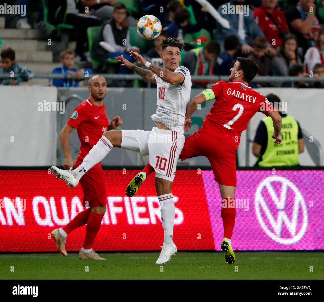 BUDAPEST, HUNGARY - OCTOBER 13, 2019: Dominik Szoboszlai #10 battles for the ball in the air with Gara Garayev #2 in front of Pavlo Pashayev (l) during the Hungary v Azerbaijan UEFA Euro Qualifier at Groupama Arena. Stock Photo