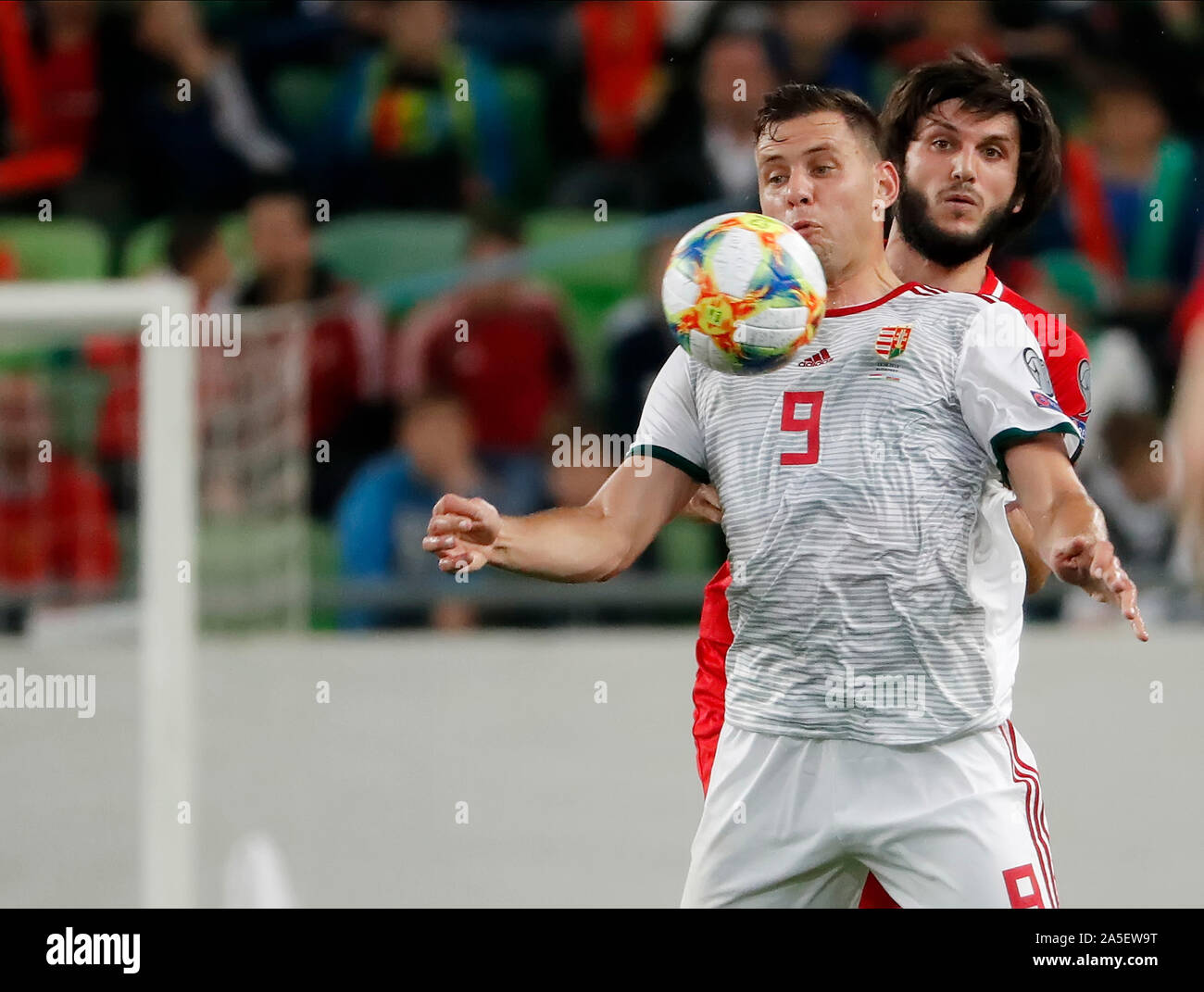 BUDAPEST, HUNGARY - OCTOBER 13, 2019: (l-r) Adam Szalai controls the ball in front of Badavi Huseynov during the Hungary v Azerbaijan UEFA Euro Qualifier at Groupama Arena. Stock Photo
