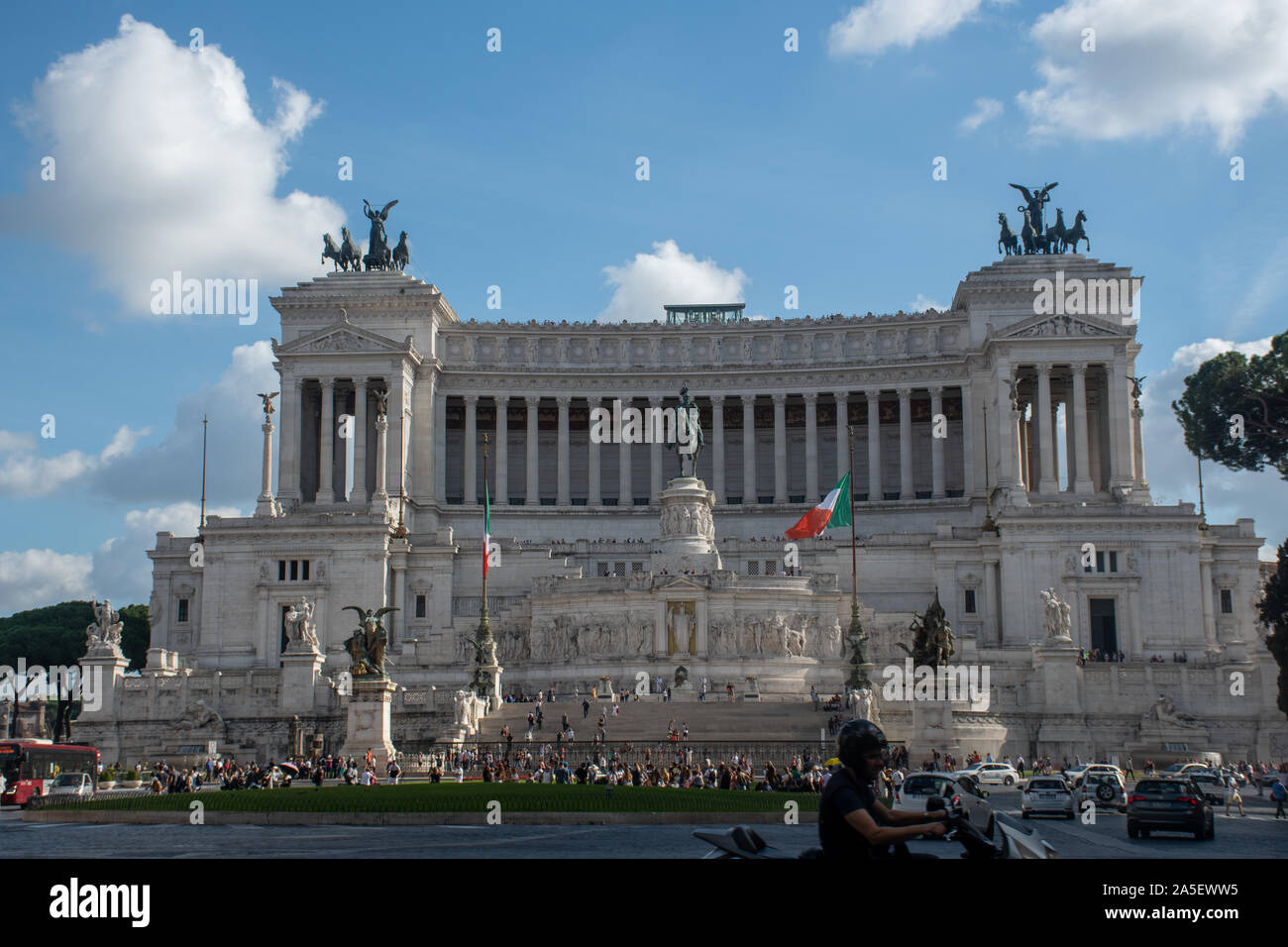 Rome Italy - 30 September 2019: Monument of Victor Emmanuel II with Scooter rider in foreground Stock Photo