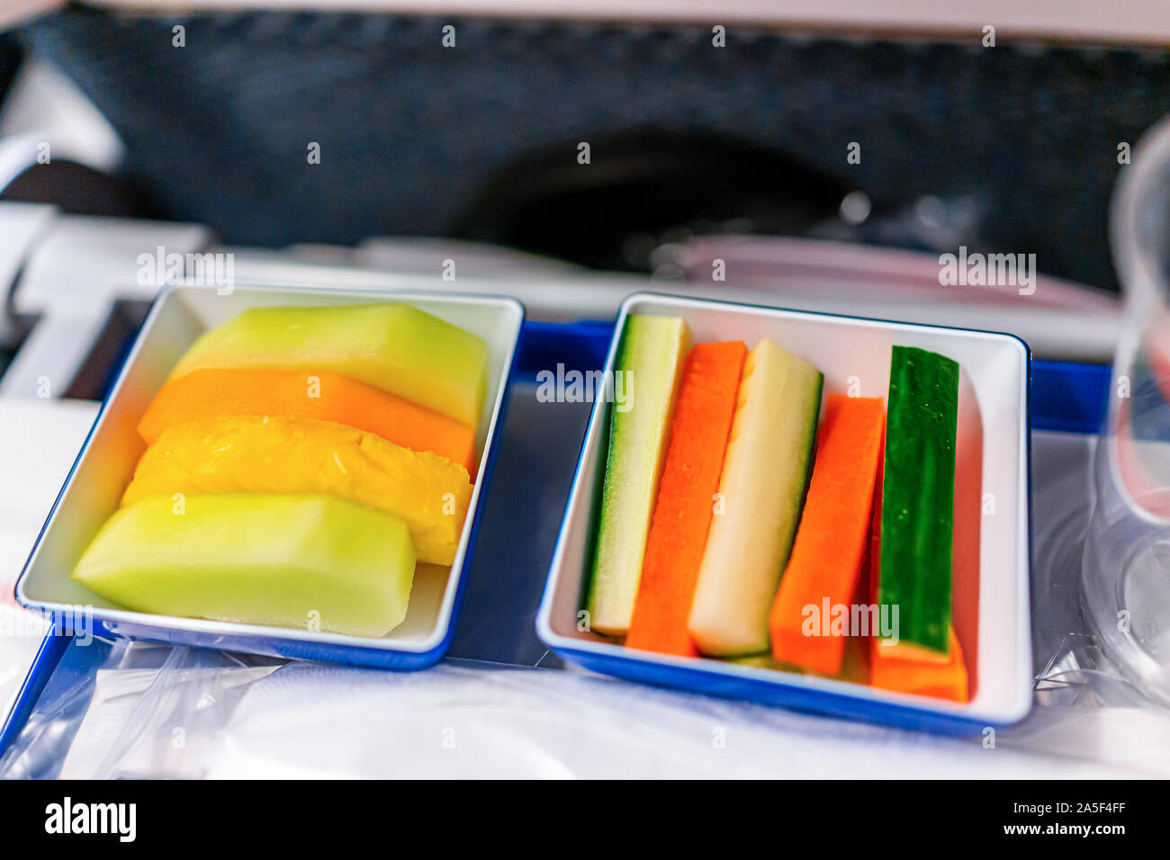Vegan food vgml healthy snack meal on airplane flight with dessert