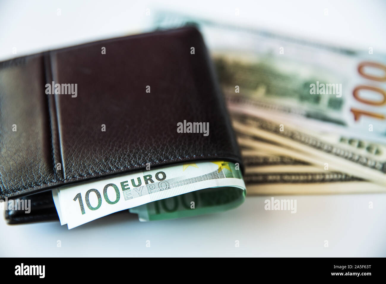 Currency in the wallet and on the table. Stock Photo