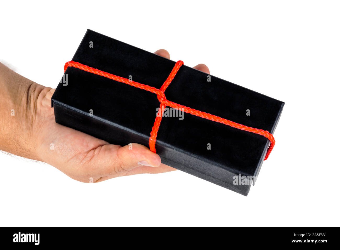 Hand holds a box with a gift. Stock Photo