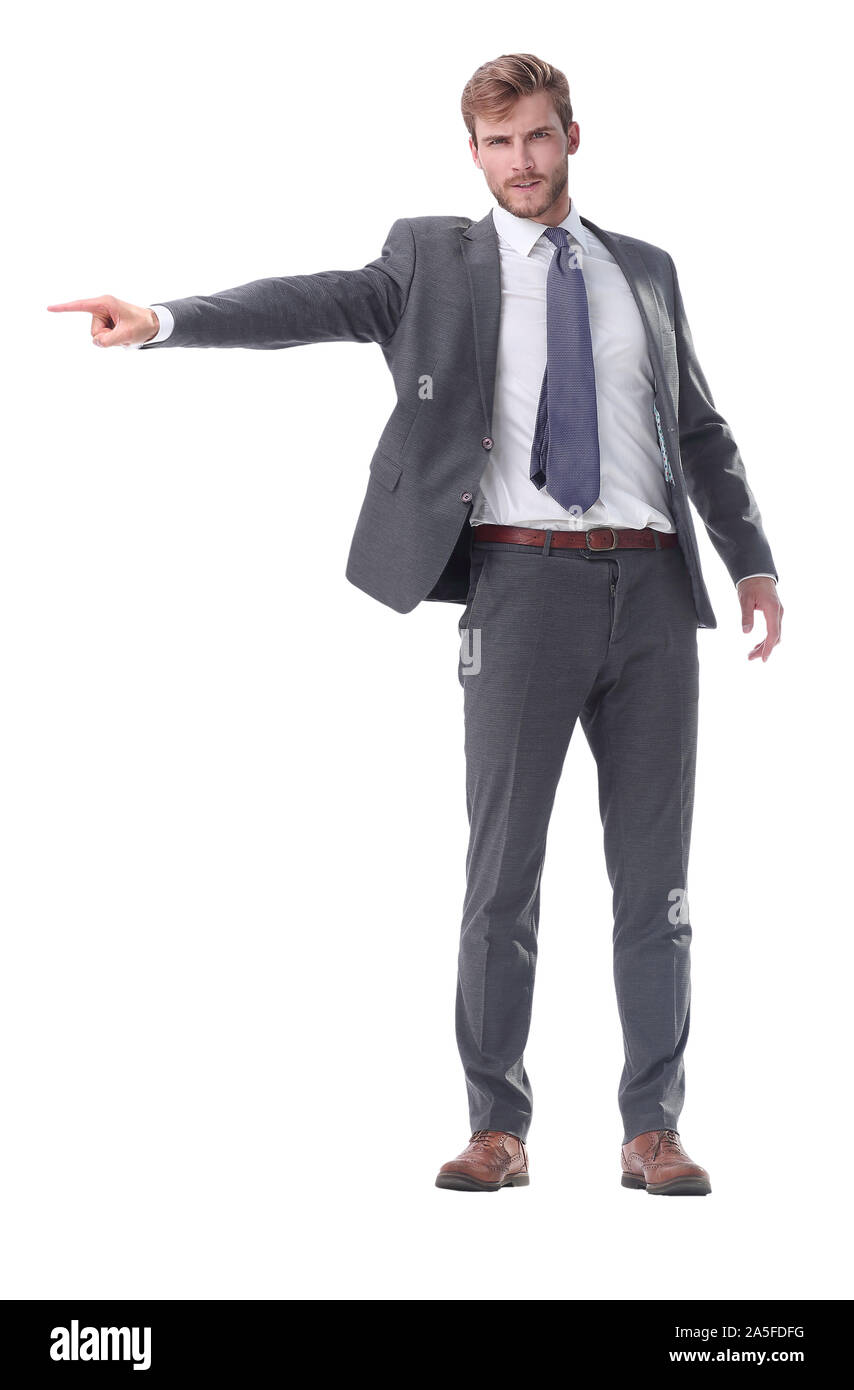 in full growth. serious businessman pointing to the side. Stock Photo