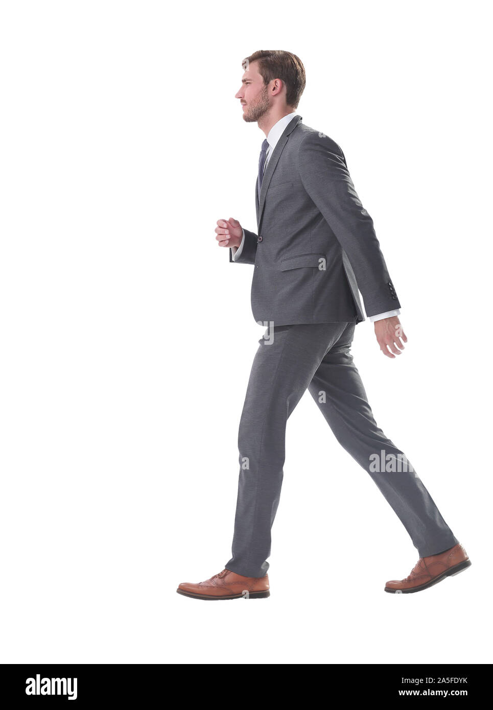 serious young business man confidently goes forward Stock Photo