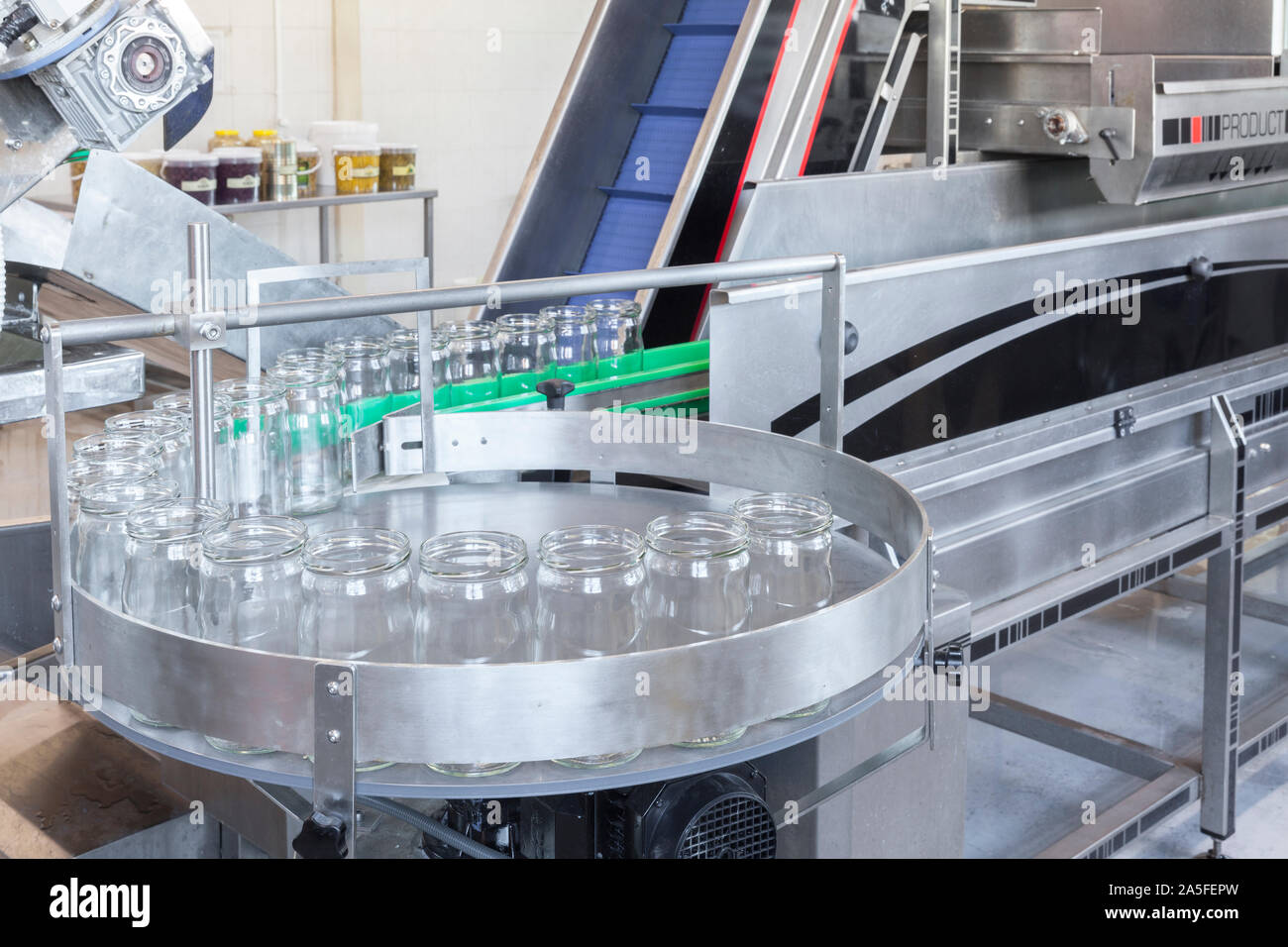 glass jars on the filling line in factory Stock Photo Alamy