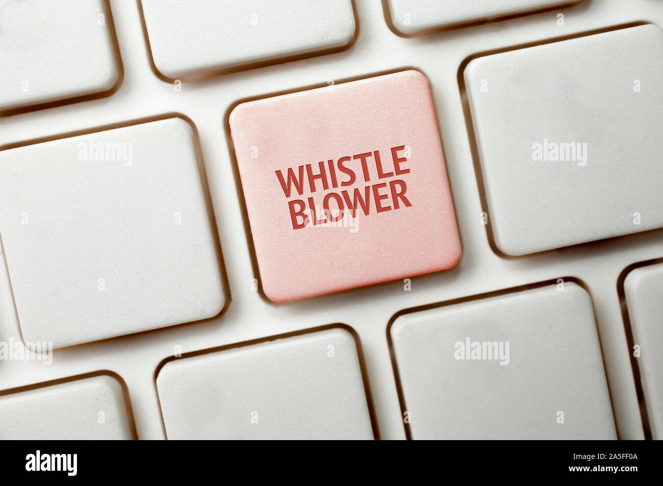 Whistleblowing concept: White keyboard with a red key and the whistleblower word Stock Photo