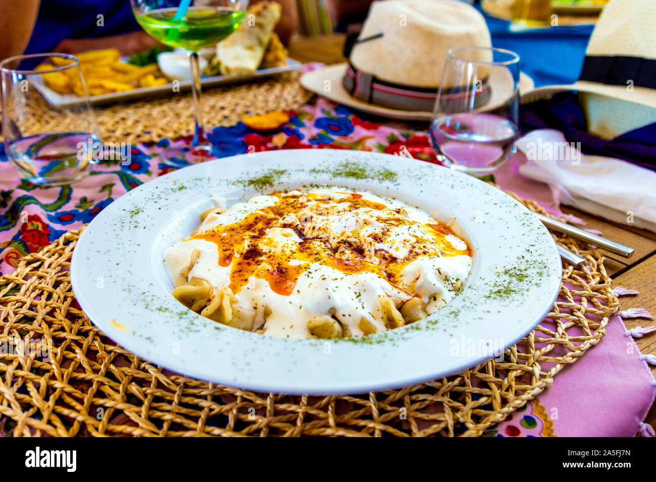 Traditional manti (Turkish ravioli) with garlic yoghurt sauce and