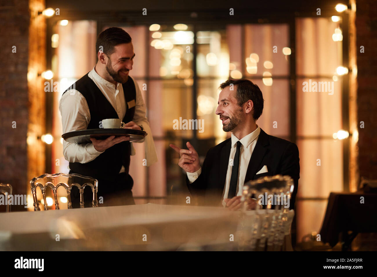 He asked the waiter to bring water. сотрудники кафе. веселый официант. Waiters bringing. официант машет рукой.