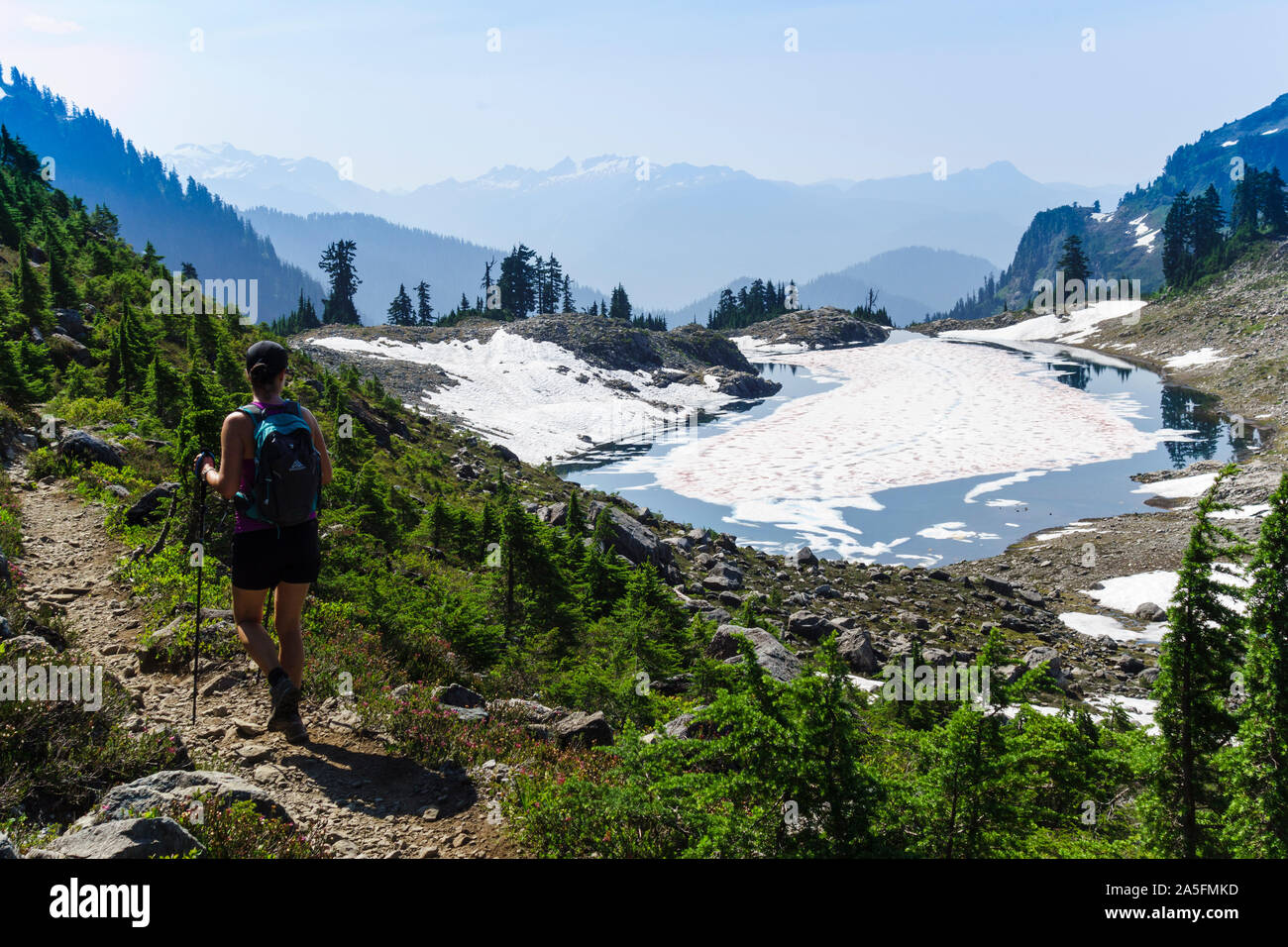 Hiker on Lake Ann trail. Mount Baker–Snoqualmie National Forest, Washington, USA Stock Photo