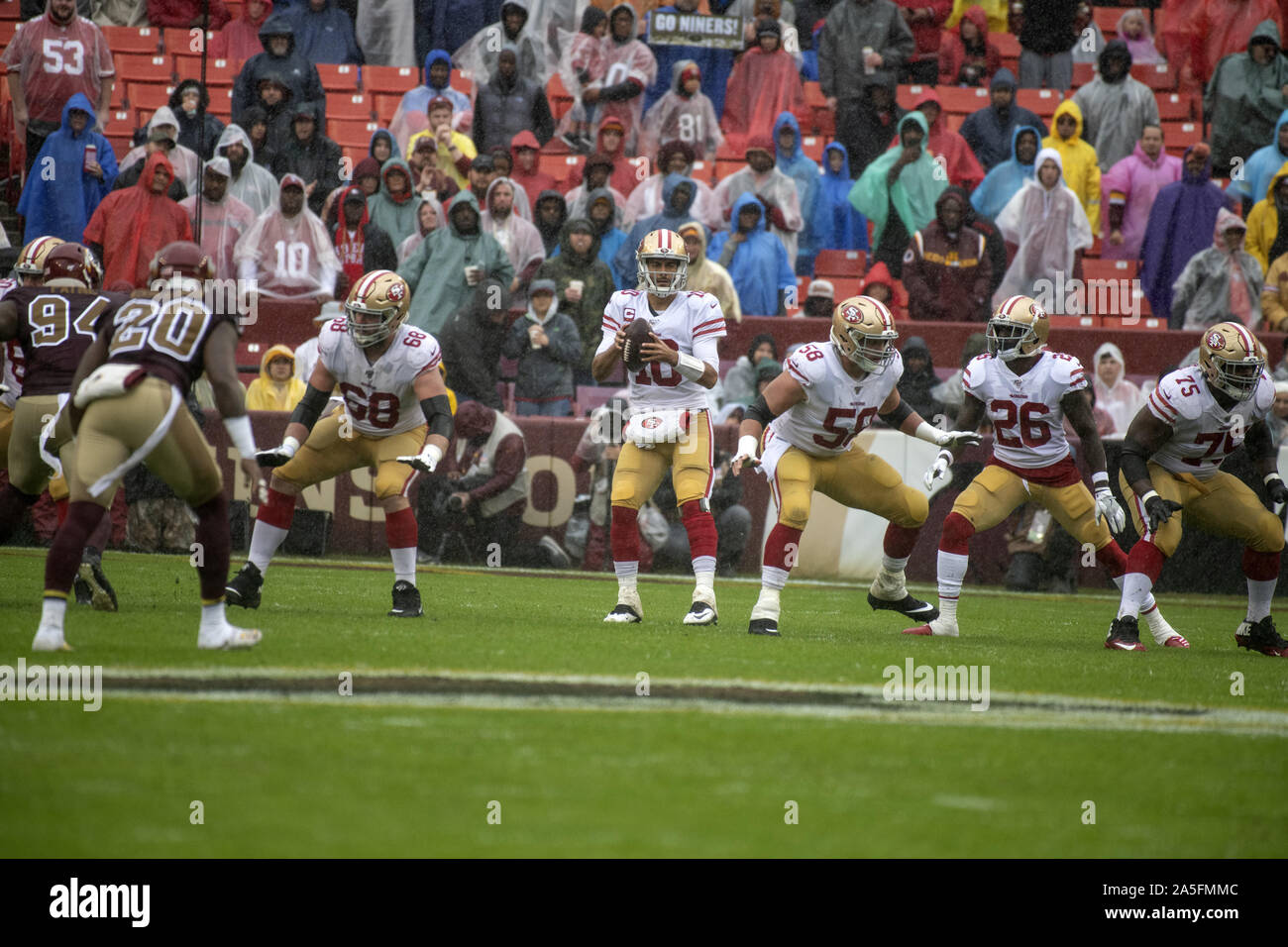 Landover, Maryland, USA. 20th Oct, 2019. San Francisco 49ers quarterback Jimmy Garoppolo (10) looks for a receiver during the first quarter against the San Francisco 49ers at FedEx Field in Landover, Maryland on Sunday, October 20, 2018. Also pictured from left are: Washington Redskins nose tackle Daron Payne (94), strong safety Landon Collins (20), San Francisco 49ers offensive guard Mike Person (68), center Weston Richburg (58), running back Tevin Coleman (26) and offensive guard Laken Tomlinson (75). The 49ers won the game 9 - 0 Credit: Ron Sachs/CNP/ZUMA Wire/Alamy Live News Stock Photo